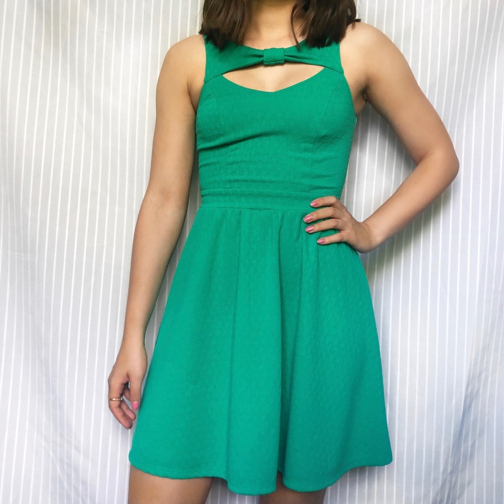 Green fit and flair dress with bow detail